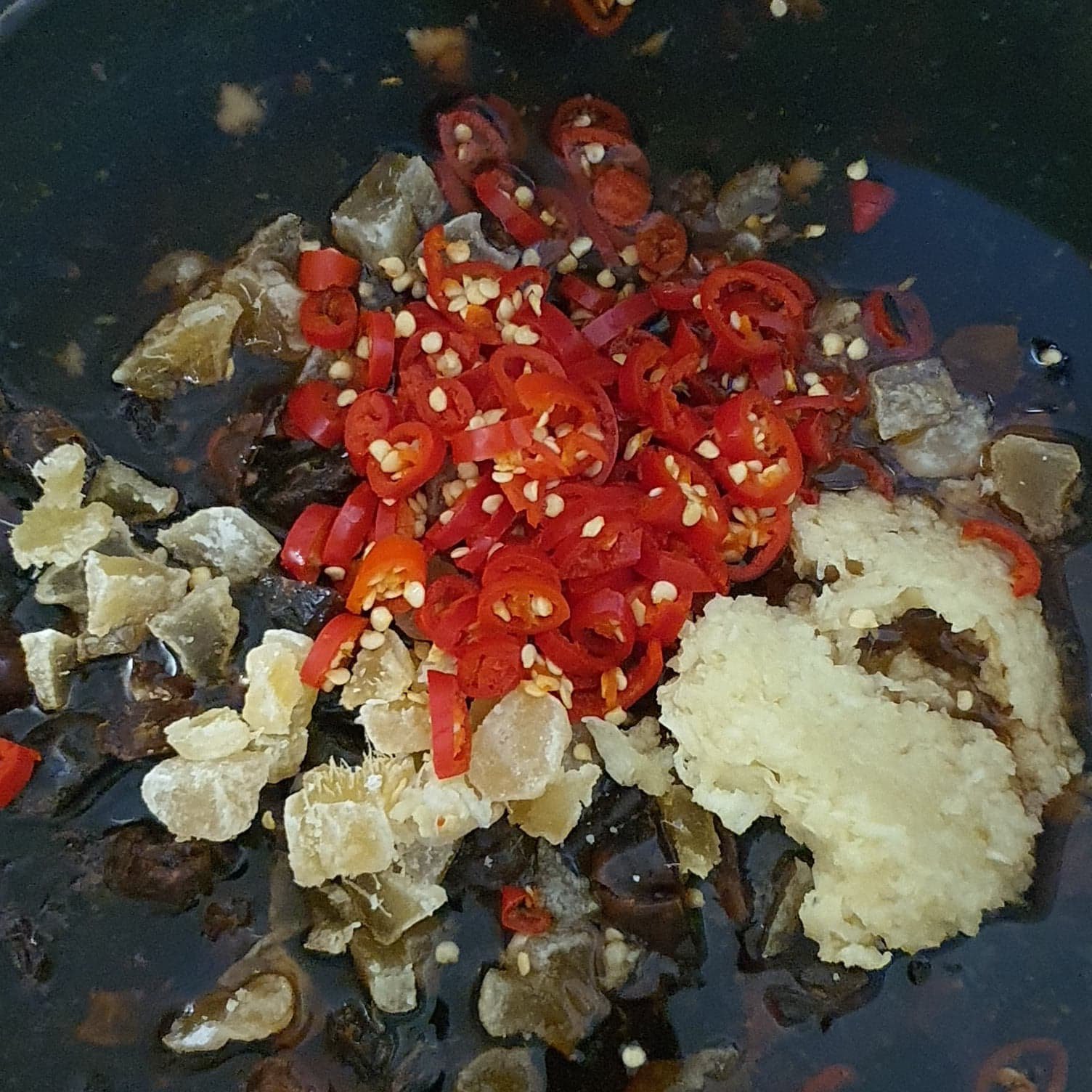 All ingredients (except mangoes) in the pan.